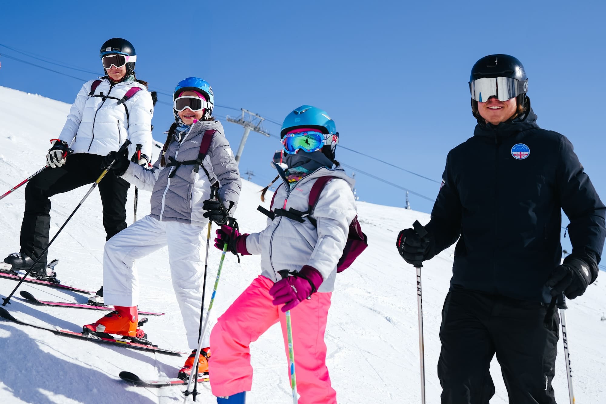Group of skiers with ski instructor in Gudauri.