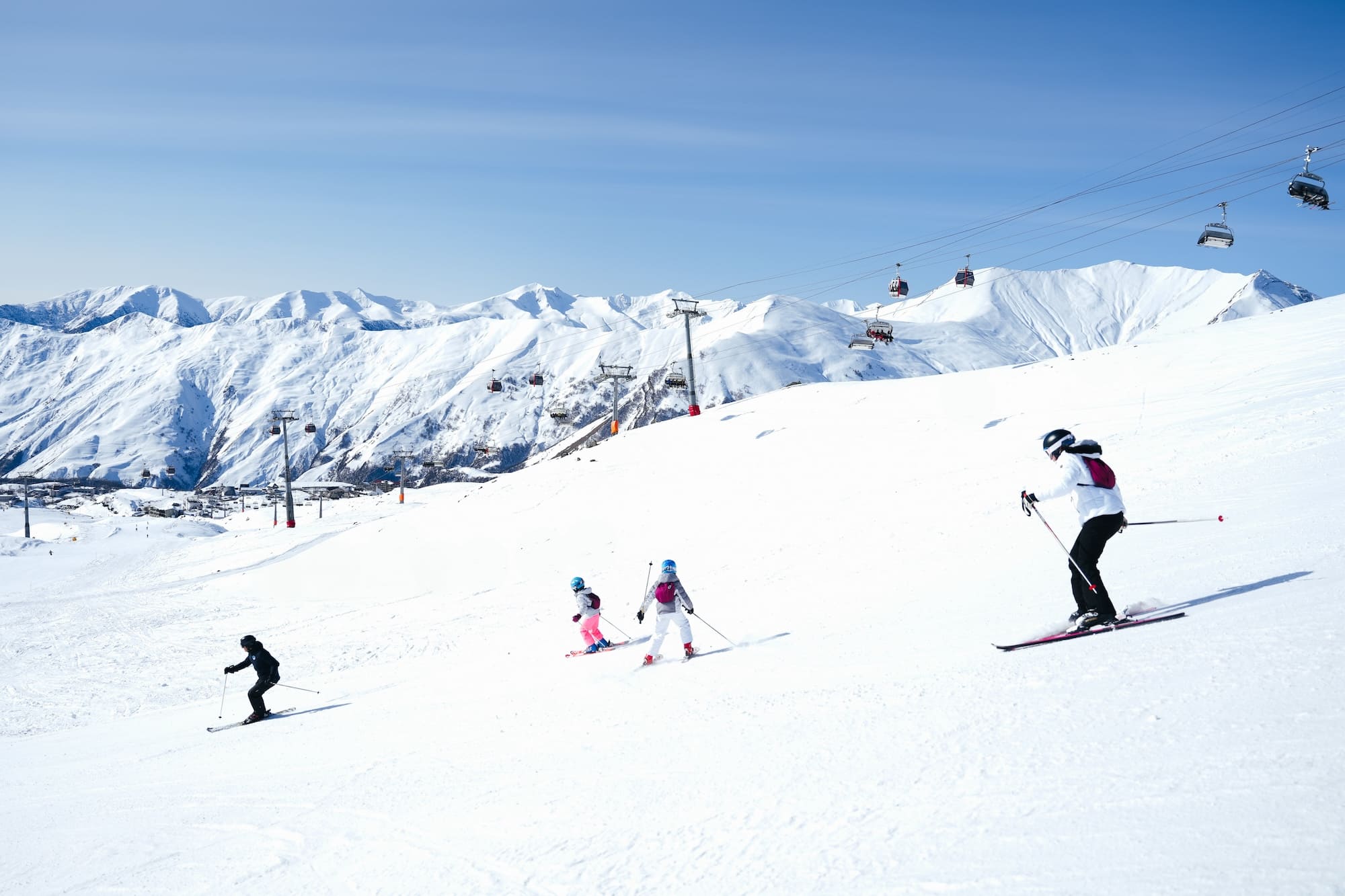 Group of skiers with Ski Gudauri instructor on the slopes of Gudauri Ski Resort, Georgia